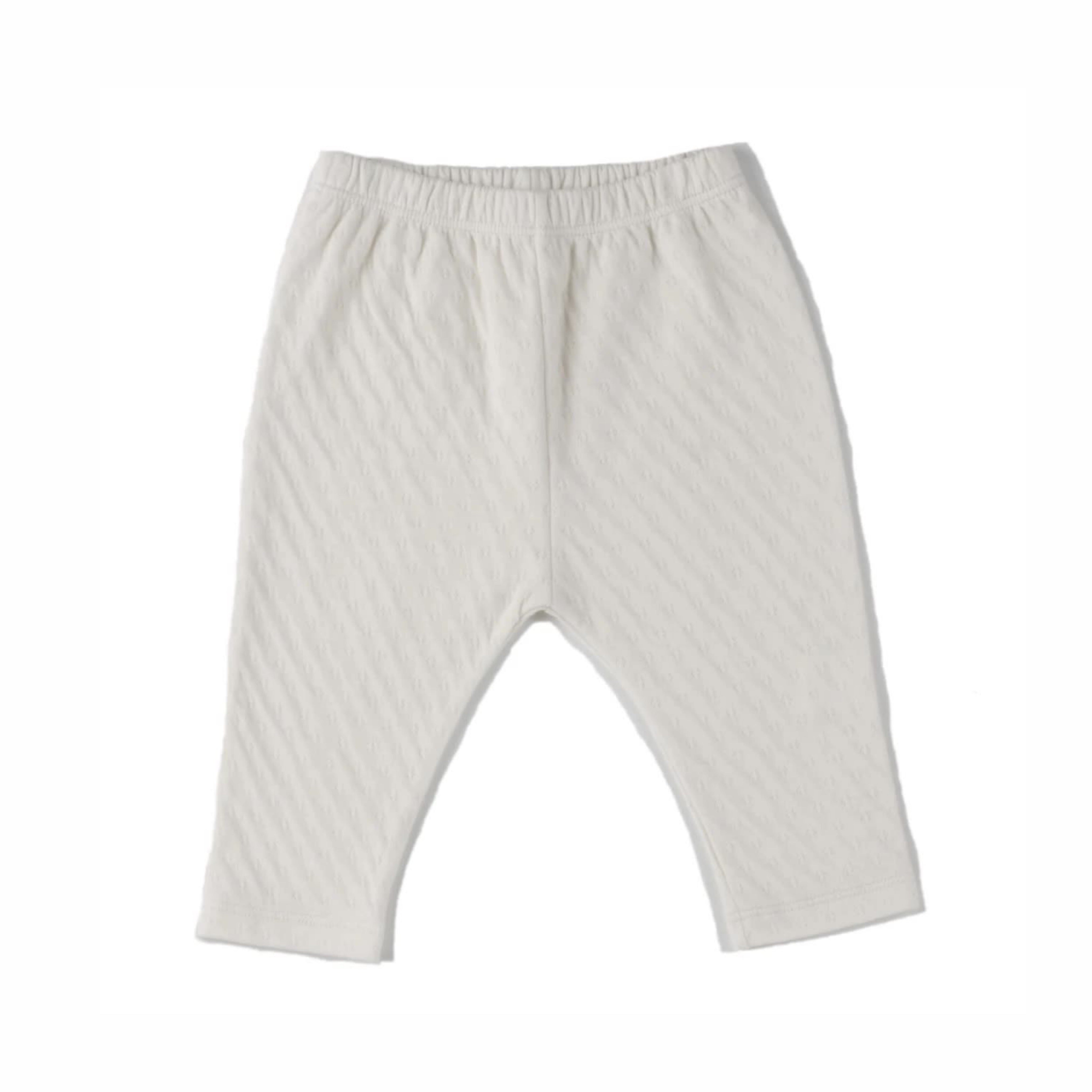 cream color straight leg pointelle ribbed pants with soft encased elastic at waistband. 100% organic cotton.