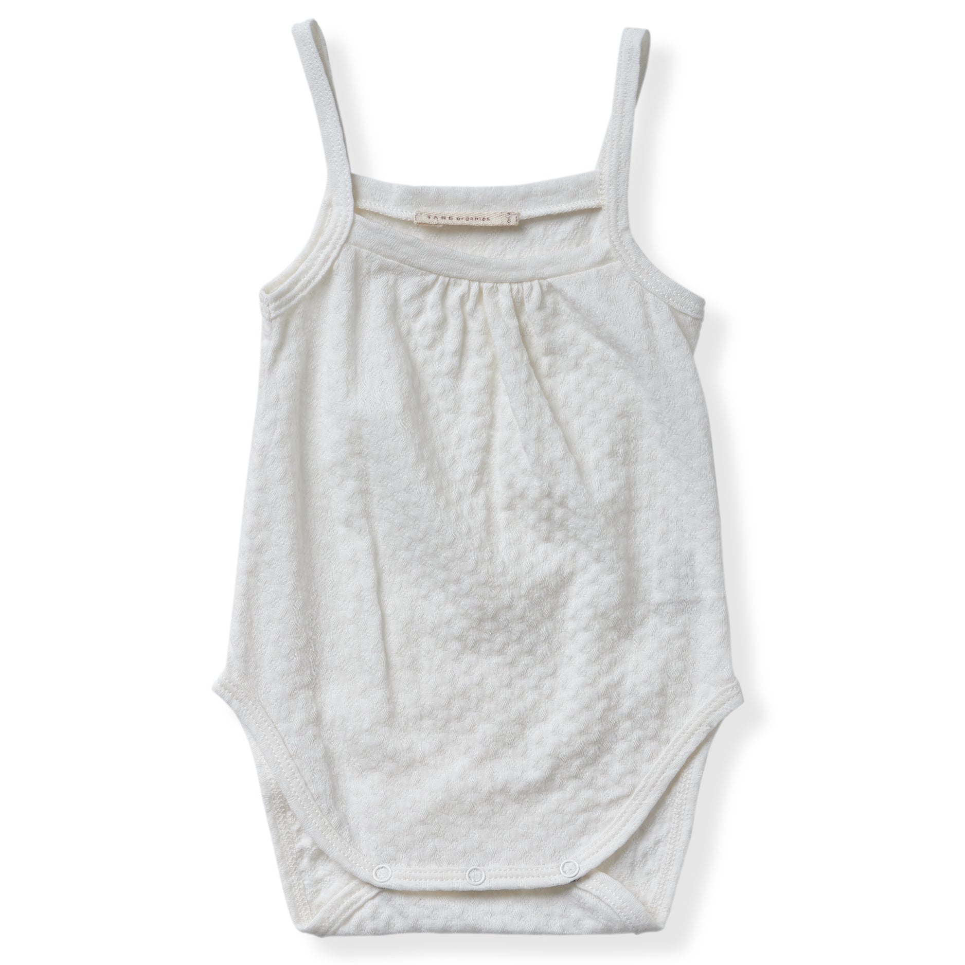 cream color pointelle tank onesie with gentle snaps.  100% organic cotton.