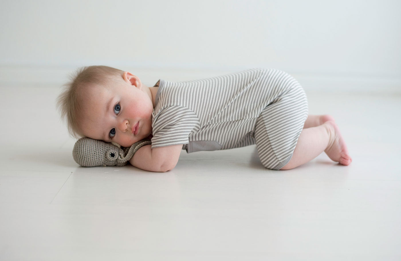 Petite stripe in cool grey and cream color short sleeved romper