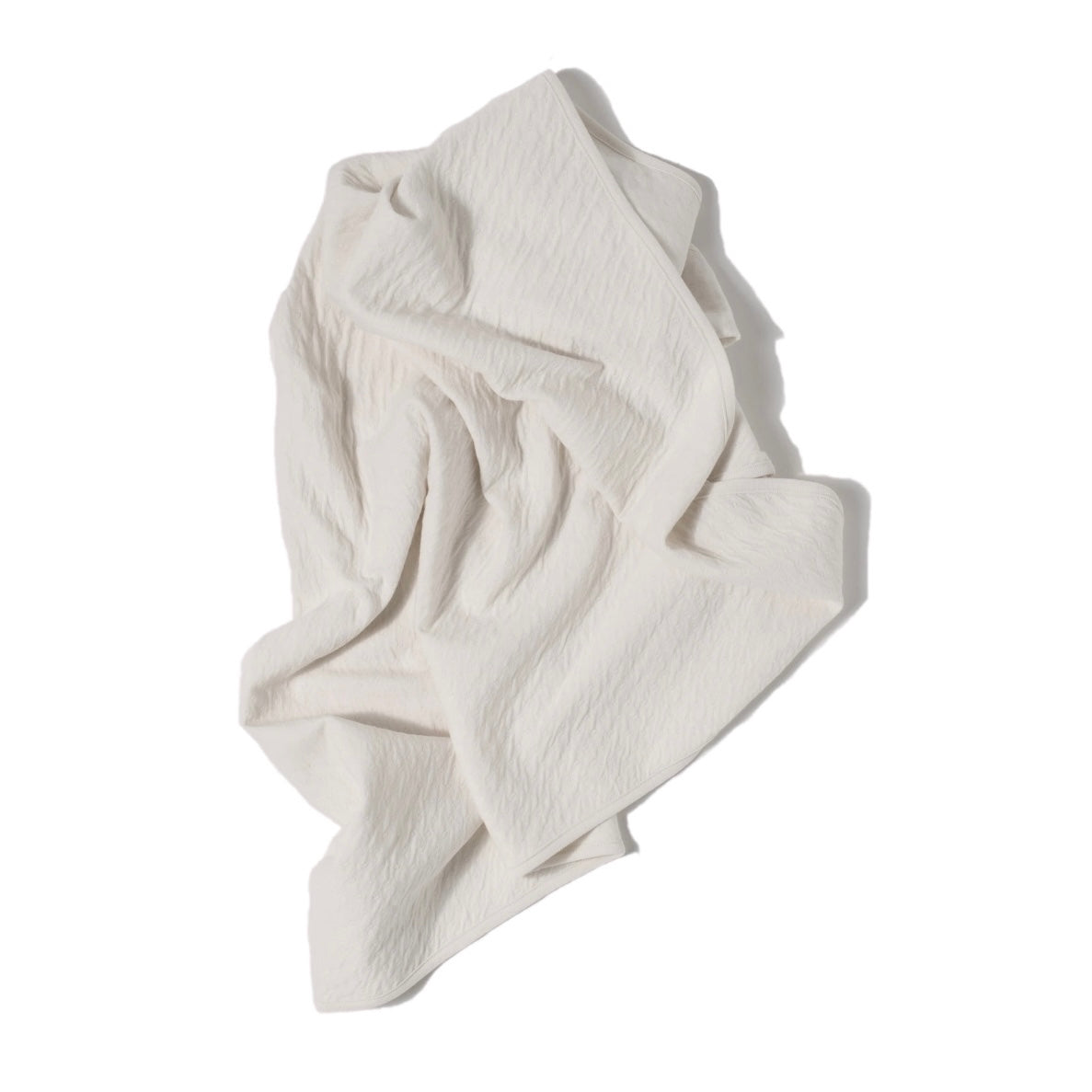 cream color pointelle ribbed knit double layered essential swaddle blanket. 33" x 33".  100% organic cotton.