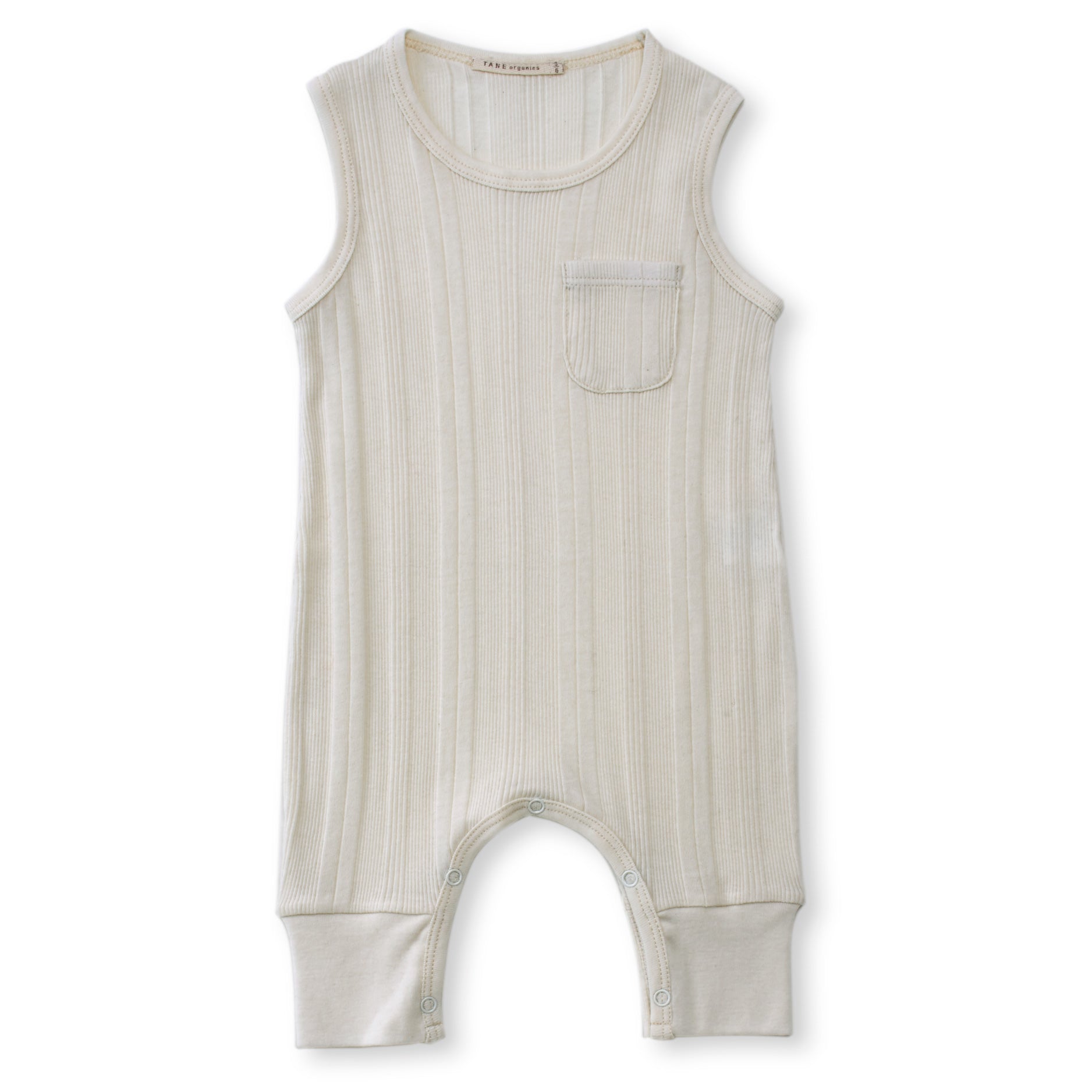 cream color multi ribbed knit sleeveless one pocket coverall. 100% organic cotton ribbed knit.