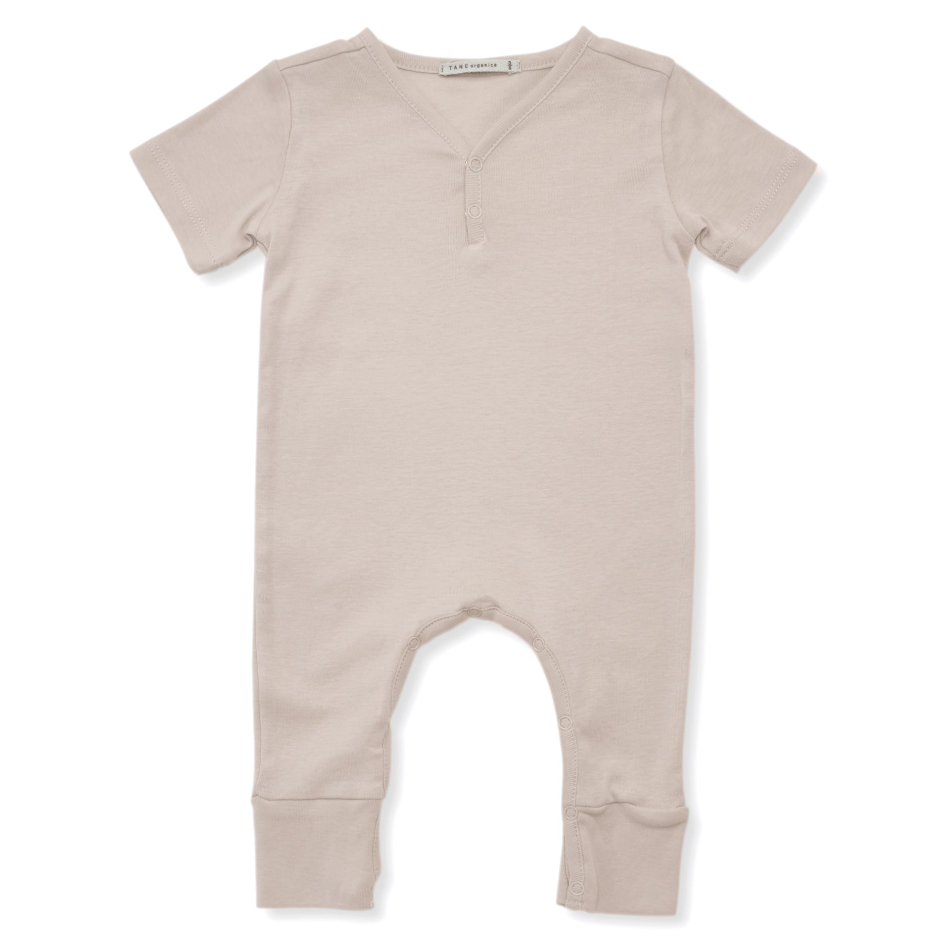 ivory  color short sleeved v-neck coverall with 2 buttons and elongated legs.  100% organic pima cotton ribbed knit.